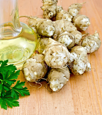 Jerusalem artichokes with oil and parsley on board