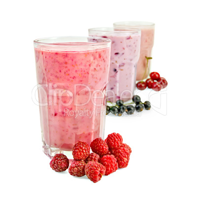 milkshakes with berries in glass a row