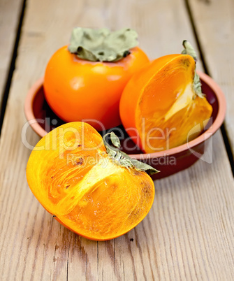 Persimmon on the board in pottery