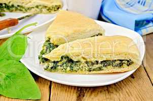 pie spinach and cheese on board with knife