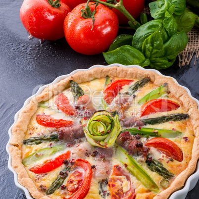 green asparagi tart with eggs and tomato