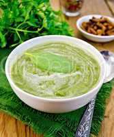 puree green with spinach and spoon on board