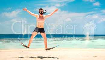 funny man jumping in flippers and mask.