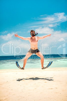 funny man jumping in flippers and mask.