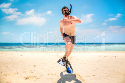 funny man jumping in flippers and mask.