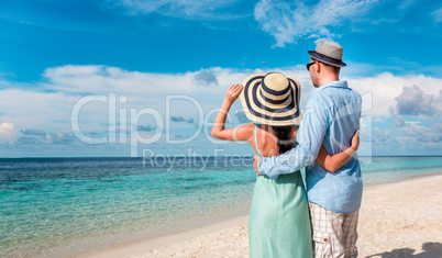 vacation couple walking on tropical beach maldives.