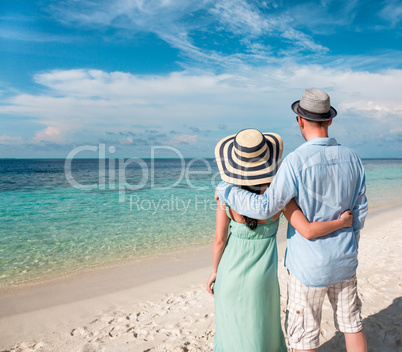 vacation couple walking on tropical beach maldives.