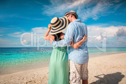 vacation couple walking on tropical beach maldives.