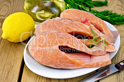 Trout in plate with lemon on board