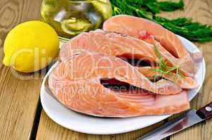 Trout in plate with lemon on board