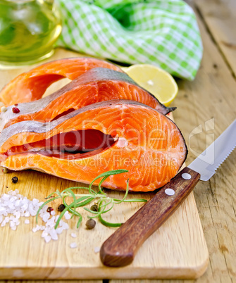 Trout with oil and knife on board