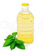vegetable oil in a bottle with basil