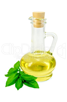 vegetable oil in a carafe with basil