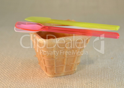 Ice cream cones and colorful plastic spoons
