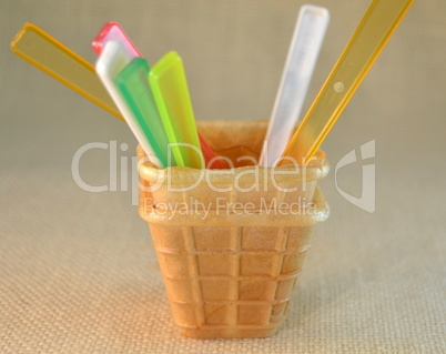 Ice cream cones and colorful plastic spoons