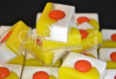 Dishwashing soap bars on a black background