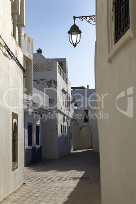 narrow alley in assila in the twilight