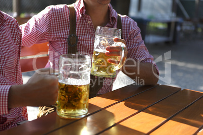 two men sitting in a beer garden