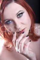 red head woman with black nails
