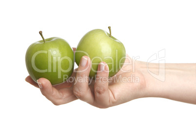 Female hand with two green apples