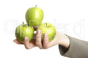 Female hand with three green apples