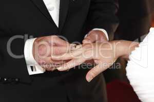 Hands of a bride and groom