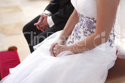 hands of a bride and groom