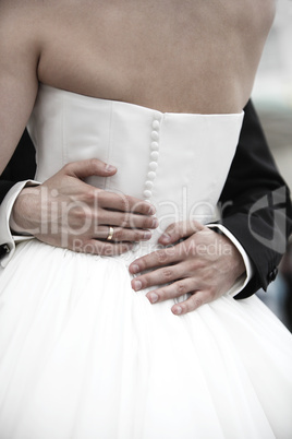 Hands of a bride and groom