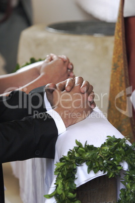 Hands of a bride and groom