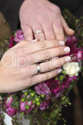 Hands of a bride and groom