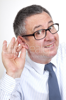 man holding his ear to hear better