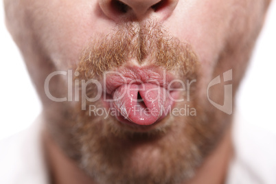 Man sticking out tongue