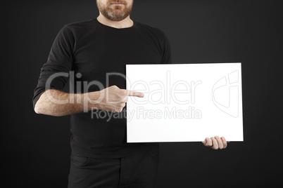 Man holds up poster