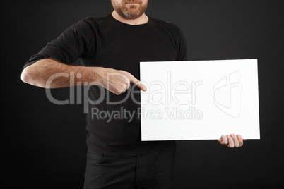 Man holds up poster
