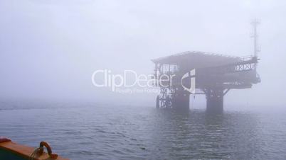 Automated gas production offshore platform in the misty sea