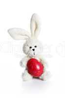 Stuffed easter bunny with red egg