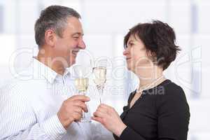 man and woman celebrating with champagne