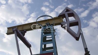 Pump jack lifting oil from well to the surface
