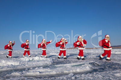 Procession of Santa Claus in the snow-covered terrain