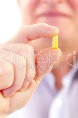 senior man taking pill