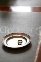 Wedding rings on a plate in the registry office
