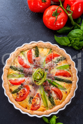 green asparagi tart with eggs and tomato