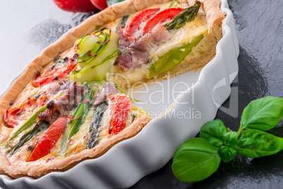 green asparagi tart with eggs and tomato