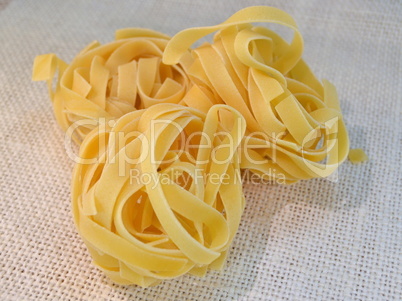 Tagliatelli italian pasta on a table