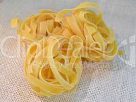 Tagliatelli italian pasta on a table