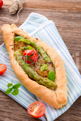 home-baked pide with green asparagi