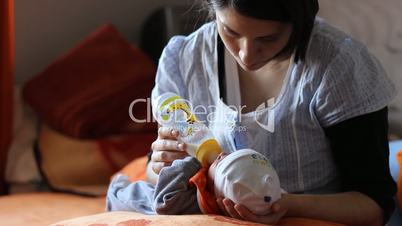 mother bottlefeeding baby