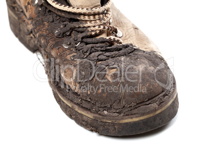 part of old dirty hiking boot on white background