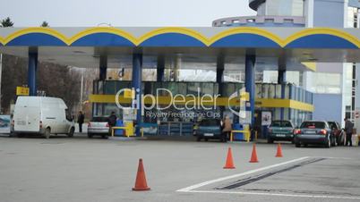 Cars Refuel In Gas Station