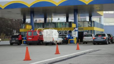 People at Fuelling Station